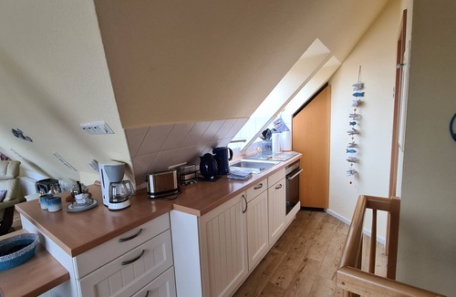 Norddeich Apartment | Cozy attic studio Norddeich panoramic window with sea view beach 50 meters
