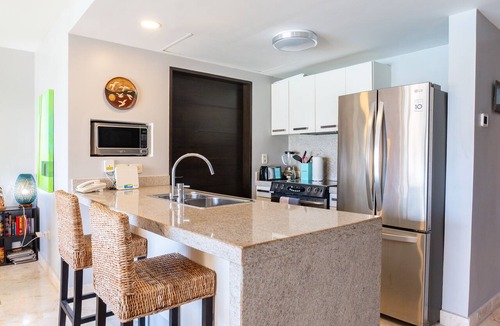 Luis Donaldo Colosio Condo | Elegant Ocean View Perfectly Situated Just steps from pool and beach at The Elements by BRIC