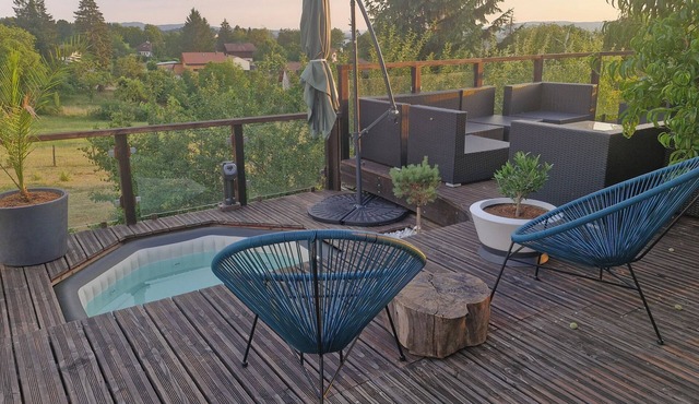 220 m² house, sleeps 8–10. With private grounds and a terrace overlooking the lake and spa