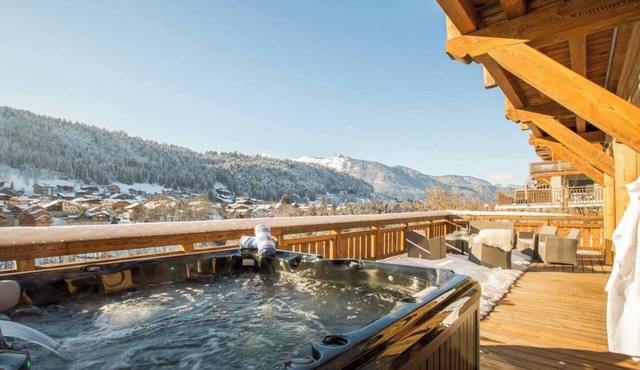 More Mountain - Chalet La Godille. Luxury Chalet with large Terrace and Outdoor Jacuzzi split over 3 levels next to the Super Morzine Telecabine.