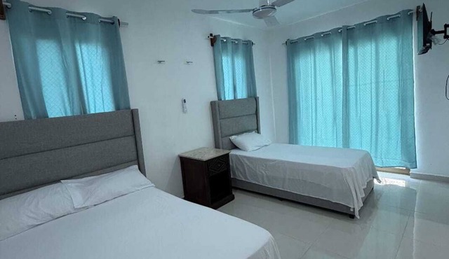Room with double bed + single bed in Xul-Ha